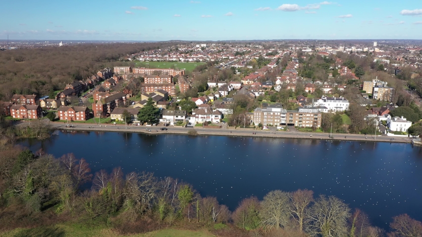 EAST LONDON BIGGEST POND WITH BIRDS FLYING OVER DRONE SHOT