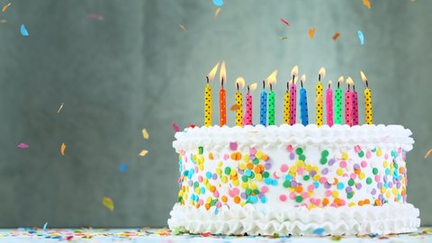 Birthday Cake With Burning Colorful Candles on Grey Background.