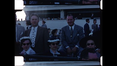 1950s Louisville, Kentucky. Men in  Suits and Women in Hats enjoy the Grandstand at Churchill Downs on Kentucky Derby Day. 4K Overscan of Vintage Archival 16mm Home Movies 