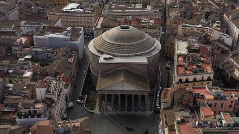 Aerial view of the Pantheon, famous landmark in Rome, Italy. Former Roman temple and now Catholic church in Roma, Italia seen from drone flying in sky. Building and tourist attraction of Italian city