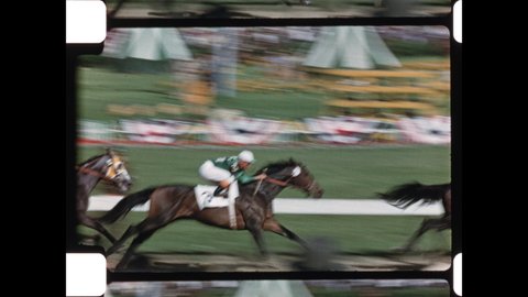 1950s Louisville, Kentucky. Horses break from the Post at Churchill Downs for 1953 Kentucky Derby. The Amateur Shaky Footage express the Excitement. 4K Overscan of Vintage Archival 16mm Home Movies