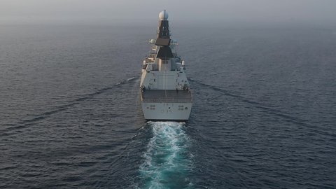 ISTANBUL - CIRCA 2020: Aerial following the warship from behind. HMS Dragon is part of the most powerful destroyer class ever built in the UK and one of the most advanced warships in the world
