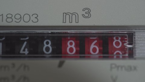 A closeup view of the dial or face of a metric gas meter in home, Ukraine