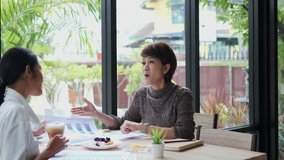 Customer asian woman paying for coffee and cake using credit card, contactless payment with waiter male at restaurant after coronavirus quarantine pandemic. - Powered by Shutterstock - Get 15% off with code: PIKWIZARD15
