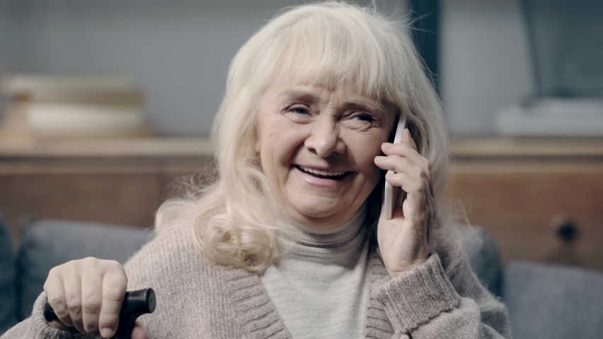Smiling senior woman talking on smartphone | Shutterstock HD Video #1069761472