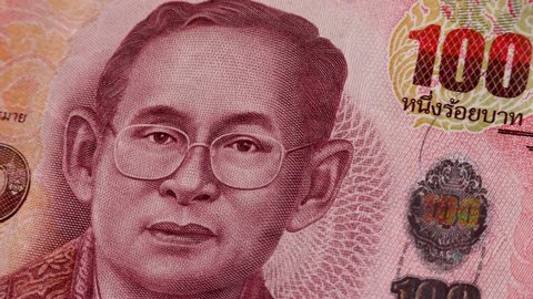 Thailand Baht or THB with Rama IX face. Issuance of currency is responsibility of Bank of Thailand. Conferred with title King Bhumibol Great, ninth monarch of Thailand from Chakri dynasty