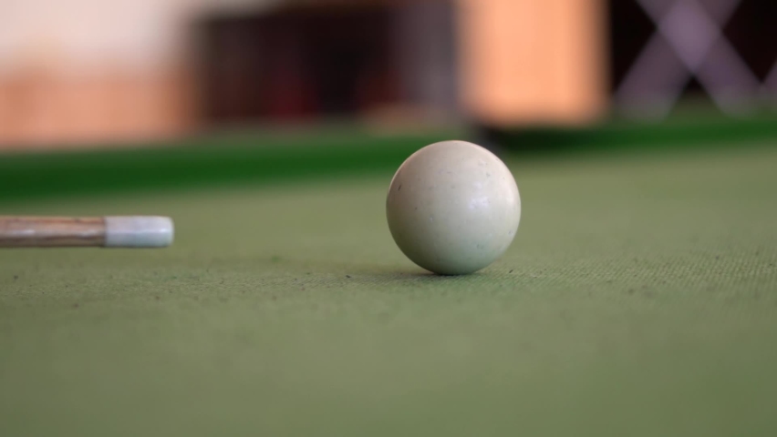 Closeup slow motion shot of cue shooting snooker ball on the snooker table. | Shutterstock HD Video #1069778350