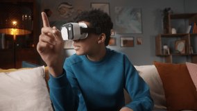 Black man teenagers playing vr video games on console or phone with gamepad. student enjoying AR 3D education learning video games, living room, virtual reality on isolation.