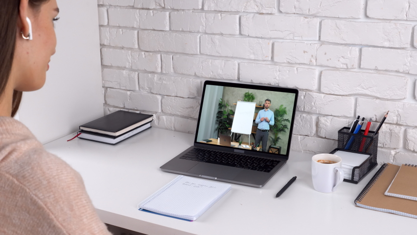 Woman at home listen watch study online remote video webinar master class course laptop webcam, drink coffee tea. Distance man teacher in computer screen tells teaches student writes on whiteboard - Powered by Shutterstock - Get 15% off with code: PIKWIZARD15