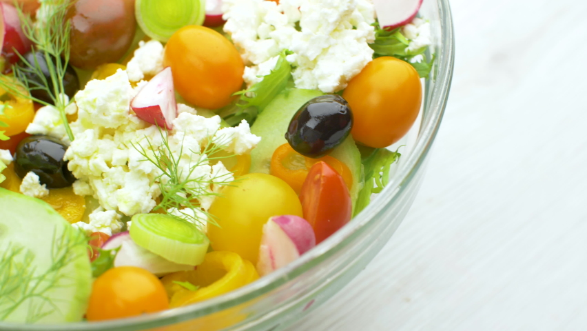 delicious mixed salad with cucumber,tomatoes,black olives and feta cheese