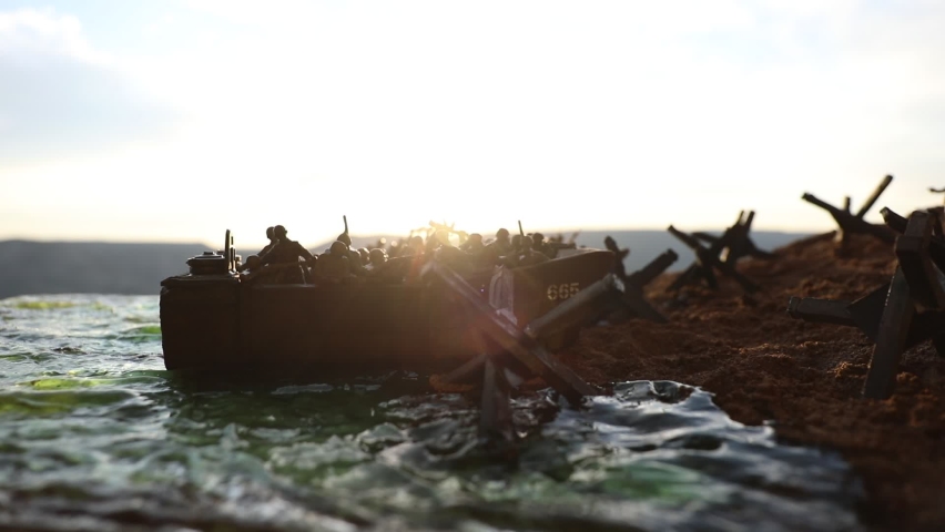 World War 2 reenactment (D-day). Creative decoration with toy soldiers, landing crafts and hedgehogs. Battle scene of Normandy landing on June 6, 1944. Selective focus