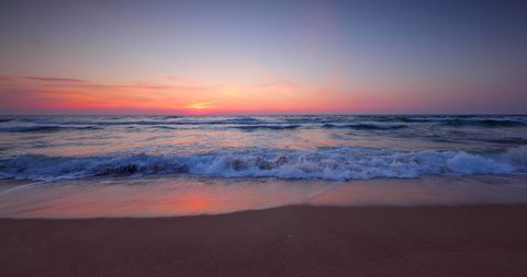 Colorful ocean beach sunrise, 4k video