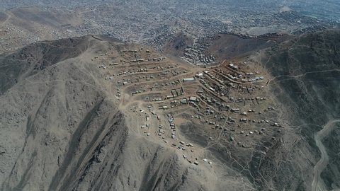 Video of a shanty town in the Andes coast hill in Lima Peru. Poverty living in hard conditions.