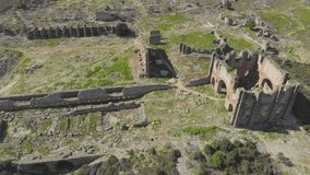 Aerial view footage of famous Aspendos Roman (amphitheater) Anthique Theater, Aspendos ruins up on the hill. Ancient city of Pamphylia in Belkiz, Antalya, Turkey