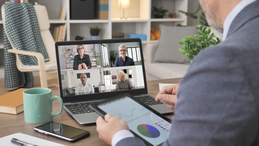 business people working remote from home discuss corporate project video call conference,man at his desk sharing company data to group of colleagues coworkers online meeting on laptop screen
 Royalty-Free Stock Footage #1069806190
