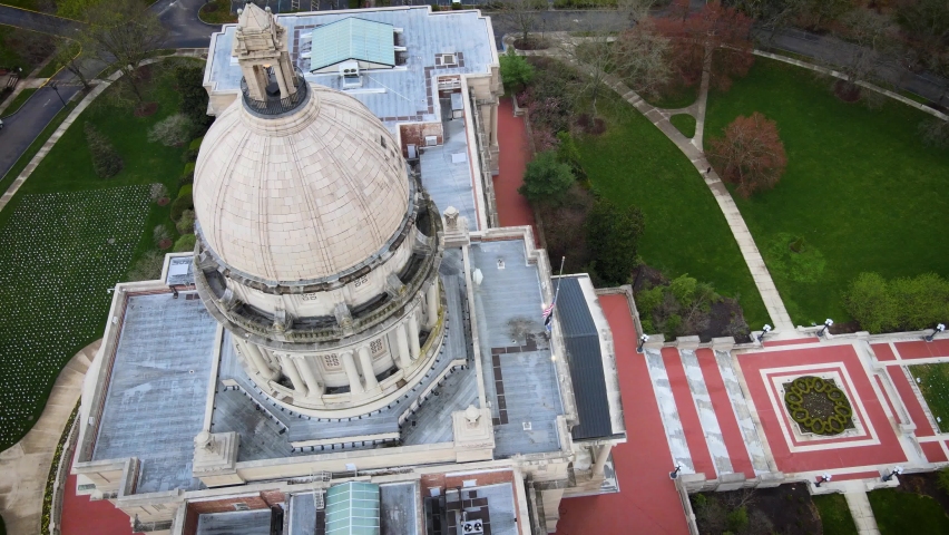 Drone shot starting with close up of a Kentucky State Capitol Building dome to revealing grounds, parks and gardens around it.