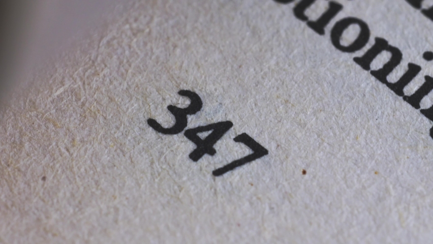 Flicking Through Old Book Page Numbers Close-up