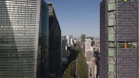 Mexico City Skyscrapers, Aerial View. Flying Between Downtown Towers and Reforma Avenue on Sunny Day, Drone Shot