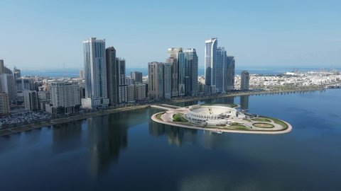 4K: Sharjah From the Top, Aerial view of Sharjah city and Khalid lake, Al Majaz Amphitheatre, Travel tourism business in the United Arab Emirates.