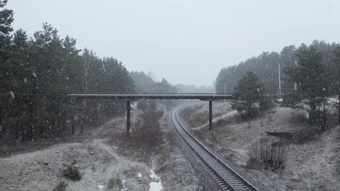 AERIAL: Overpass Bridge over the Railway on a Snowy Day
