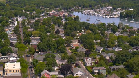 Flying Over a Small Suburban Neighborhood with a Marina in Long Island