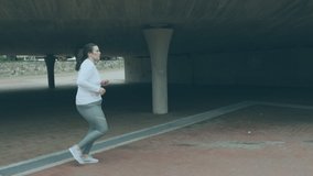 Animation of good vibes text in repetition in outline, white and blue over woman jogging. retro video game concept digitally generated video.