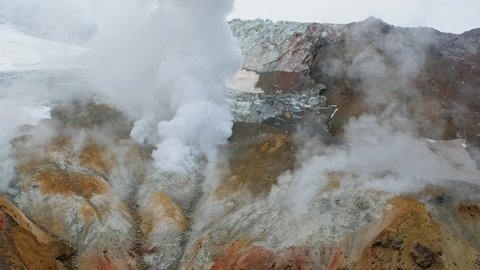 Landscape with fumaroles in crater of active Mutnovsky volcano, Kamchatka, Russia, 4k