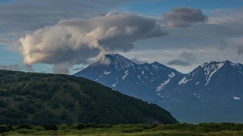 Dramatic spectacular lenticular cloud formation over volcano on Kamchatka peninsula, Russia, timelapse 4k