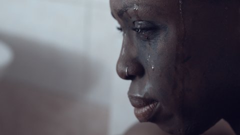 sadness, cry - depressed black woman cries desperately alone