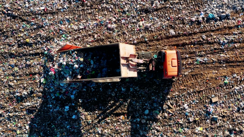 Truck unloading garbage, waste at landfill, junkyard. City dump aerial view. waste mangement, recycling. dump garbage truck. ecology concept, earth, environmental problems. | Shutterstock HD Video #1069858327