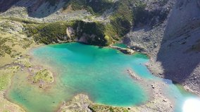 Aerial footage of  Imatly-Jagaly lake on sunny autumn day. Arkhyz, Caucasus, Russia.