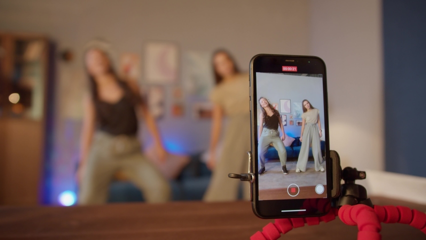 Teenagers womans shooting together dancing at home when making video for social media, stories hip hop popular trandy dance, students at home make content | Shutterstock HD Video #1069865326