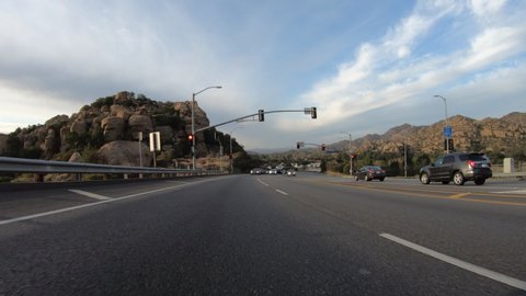 Los Angeles, California, USA - March 10, 2021:  Rear view driving plate shot of Stoney Point and Topanga Canyon Blvd in the Chatsworth area of the San Fernando Valley.  