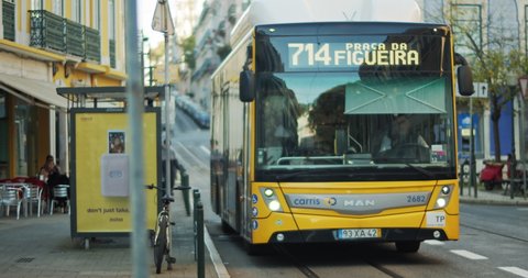 Lisbon, Portugal - Dec. 07, 2019: A public yellow bus leaves the station.