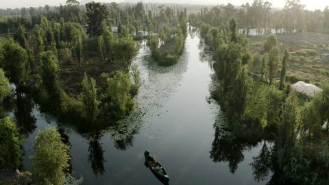 Xochimilco Channels and floating gardens —chinampas— in the morning slow drone shot