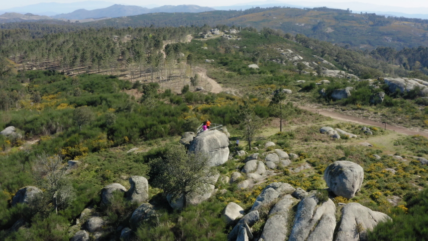 Northern Portuguese boulders percolating mountain top in Alto Minho region - Aerial Wide Panoramic shot