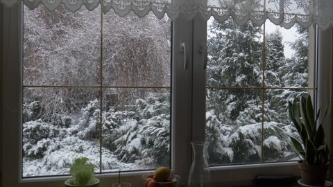 It`s snowing outside. View from the window