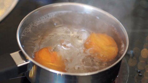 Eggs boiling in the pot in slow motion 180fps

