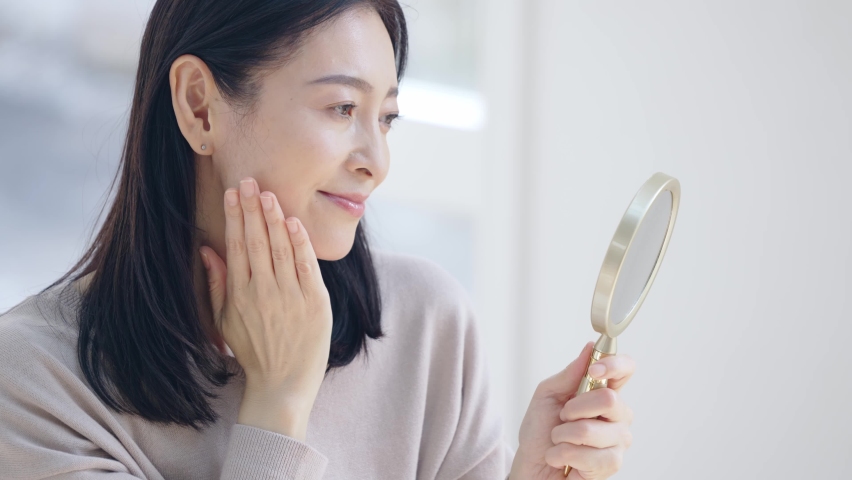 Beauty concept of middle aged asian woman. Skin care. Hair care. Royalty-Free Stock Footage #1069893892