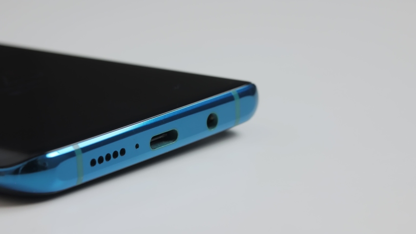 Close-up of the charging connection to your phone. Phone charging port. Charging your phone by wire.