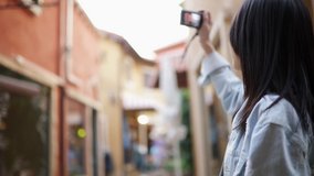 Beautiful Asian travel  Young Women taking photos with  camera.Self portrait of beautiful young  woman. Stylish woman shoots urban landscapes
