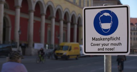 Mask compulsory sign Cover your mouth downtown with passers-by in traffic during the Corona pandemic Munich Bavaria Germany 03.11.2021