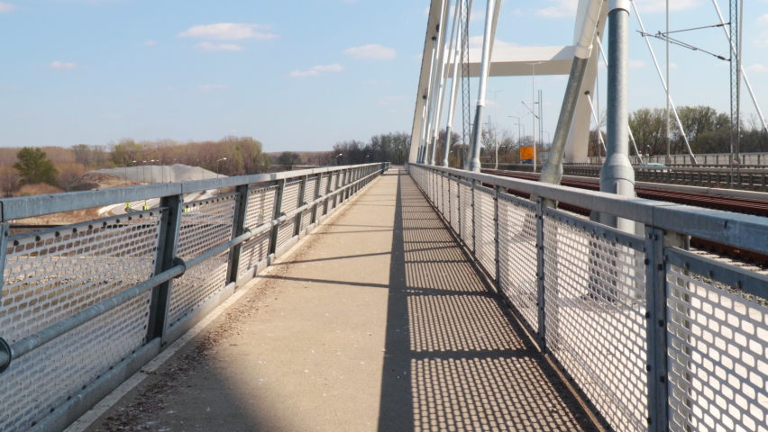 Pedestrian path and construction of a new bridge with a steel protective fence for pedestrians and vehicles
