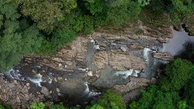 Still video of a tropical stream running in the tropical forest of the Andes between rocky outcrops