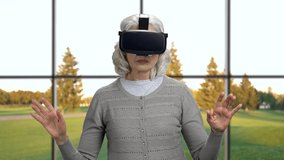 Mature woman wearing virtual reality glasses.