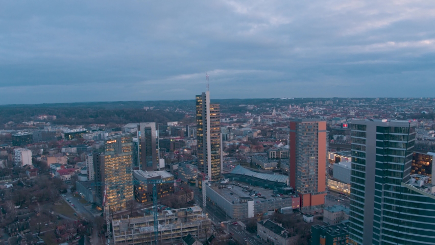 Flying over down town Vilnius after sunset. Royalty-Free Stock Footage #1069934185