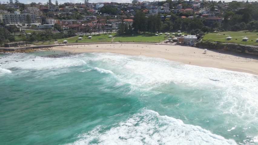 Bronte Beach During Summer - White Waves In The Ocean - Bronte Park, NSW, Australia. - aerial