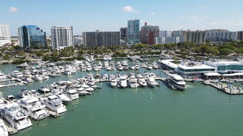 Aerial of downtown Sarasota, Florida. Rail cam view from the sea showing the marina, restaurants, and the winter motor yachting community