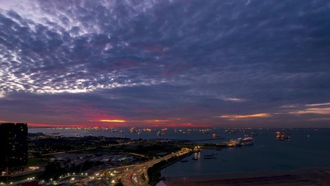 Time-lapse video of burning sky at the ocean with altocumulus in the morning.