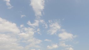 Puffy fluffy white clouds n building motion cumulus cloudscape moving on beautiful sunny clear blue sky in tropical summer or spring sunlight ray, Nature background 4k cinemagraphs b-roll TimeLapse